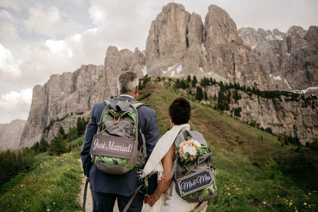 Just married couple hiking in mountains