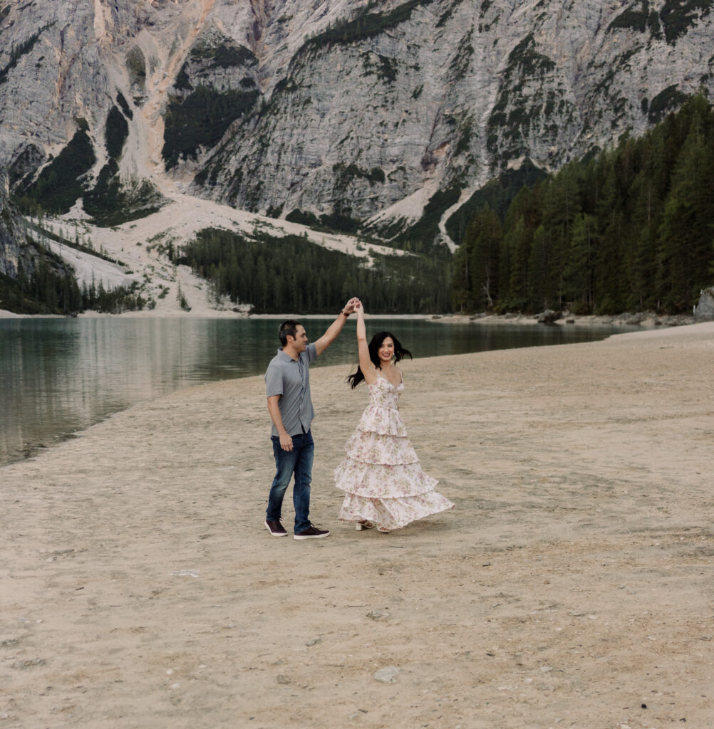 Couple dancing by mountain lake