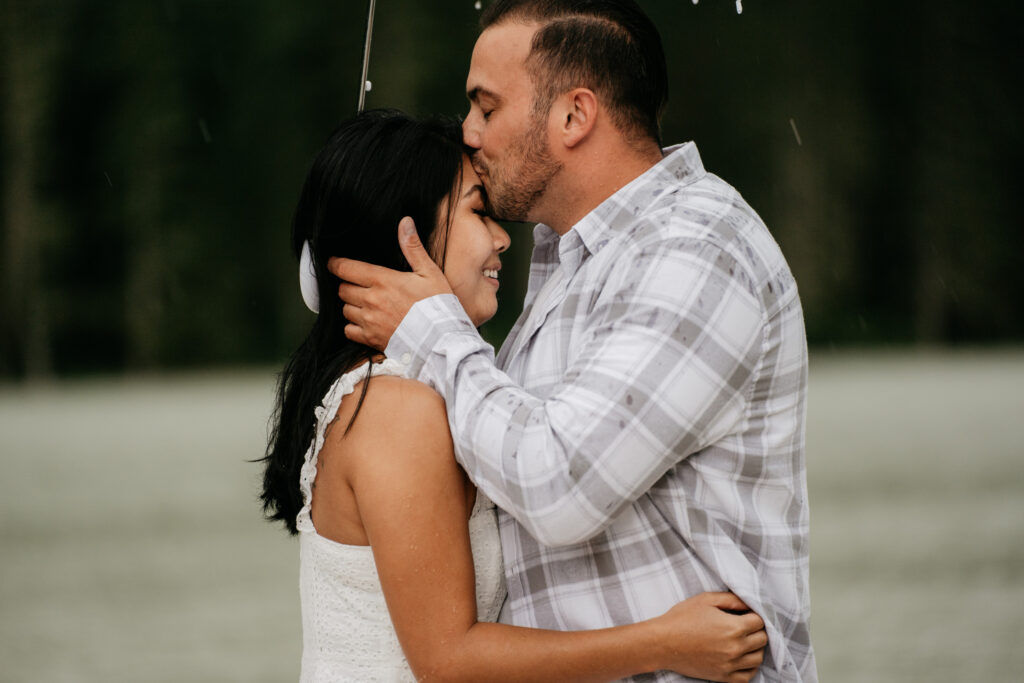 Couple embraces in the rain