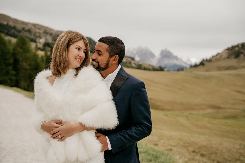 Couple embracing in scenic mountainous landscape