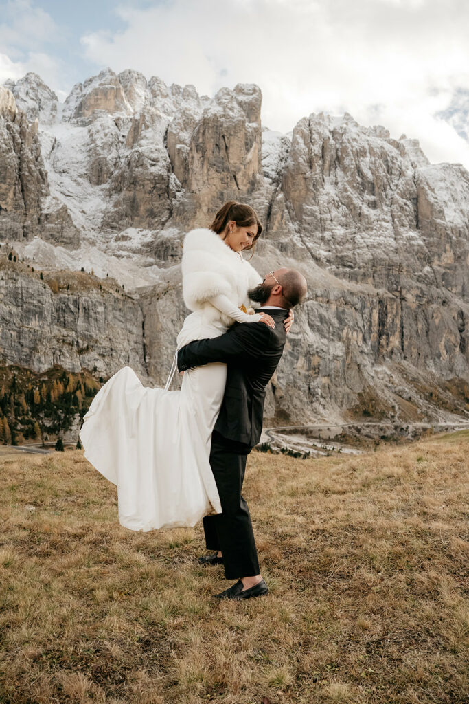 Couple embracing in snowy mountain landscape