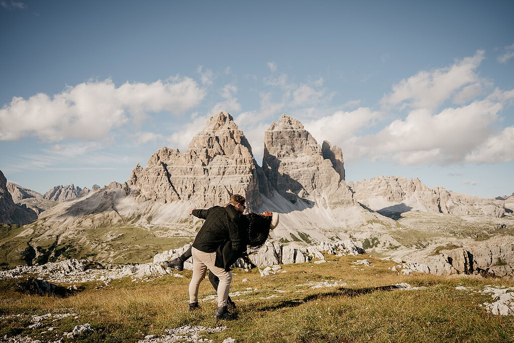 Couple dancing in mountain landscape