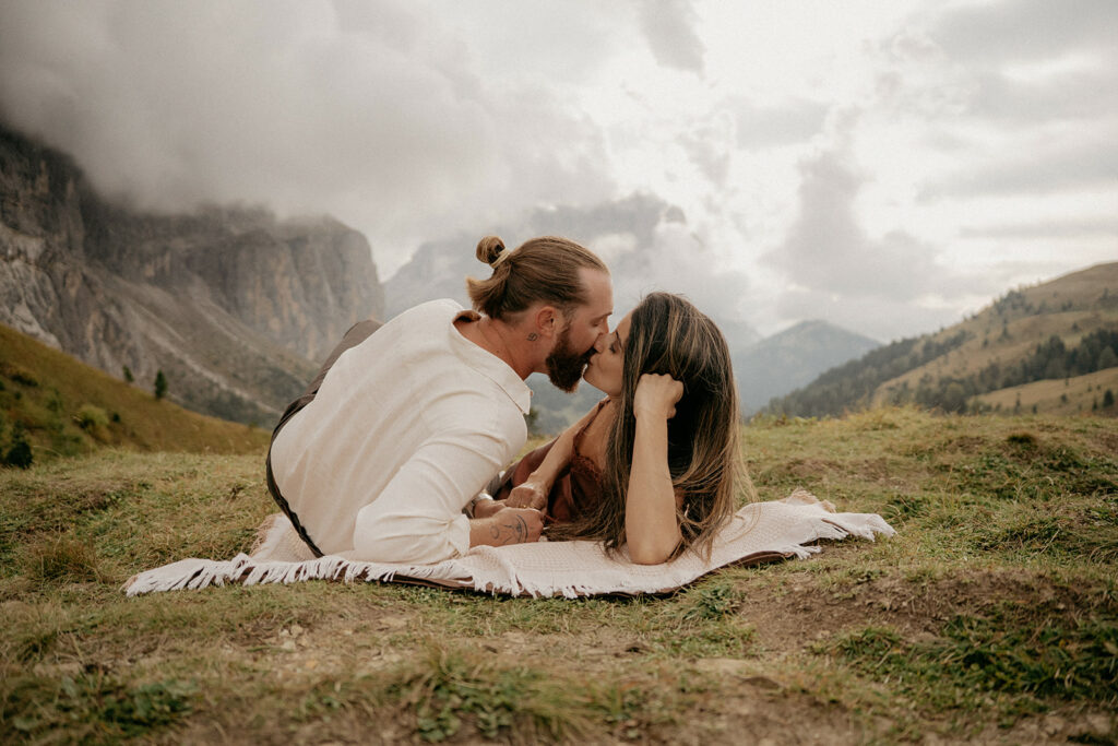 Couple kissing on mountain landscape