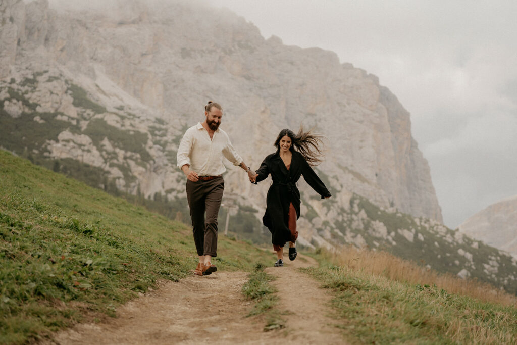 Couple running on mountain trail