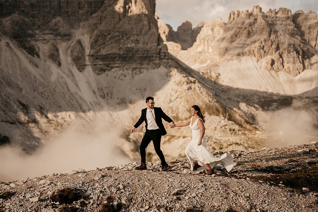 Couple walking in rocky mountain landscape