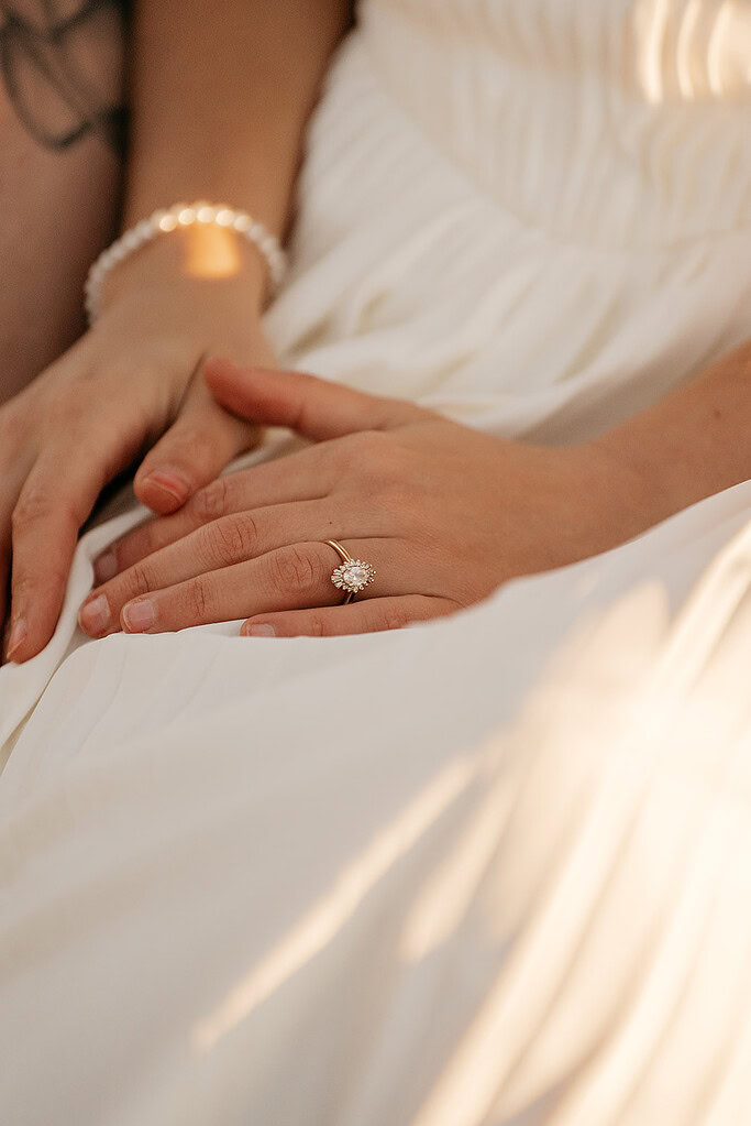 Close-up of hands with engagement ring