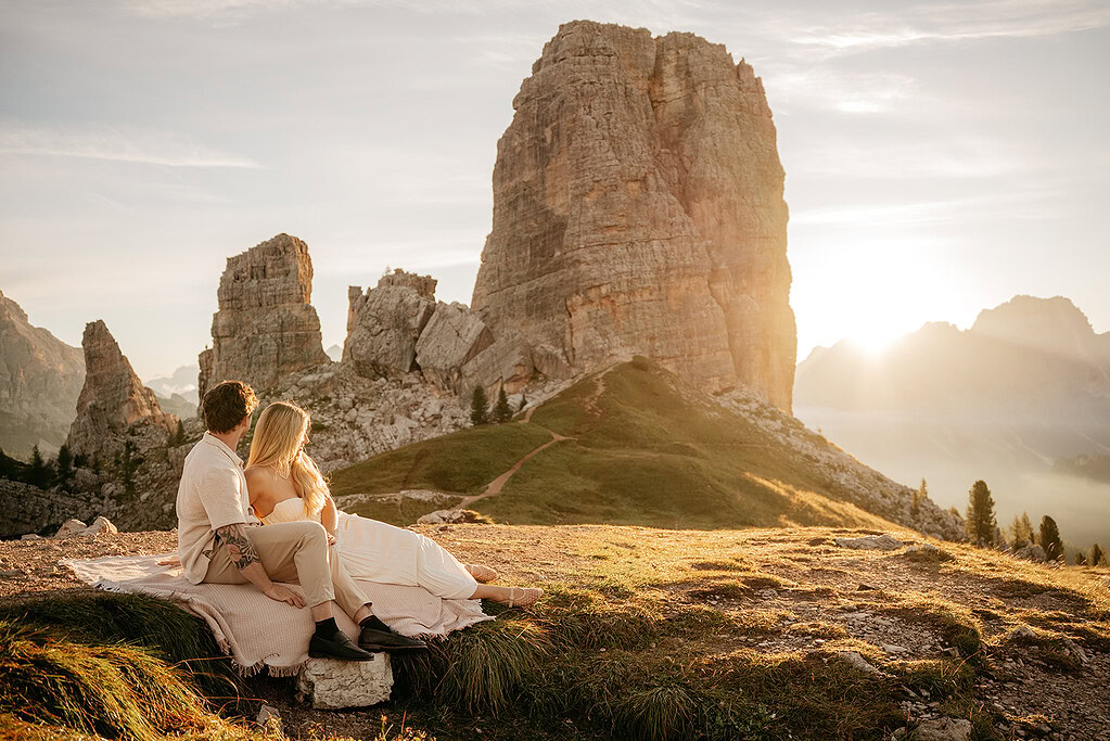 Couple enjoying mountain sunset scenery