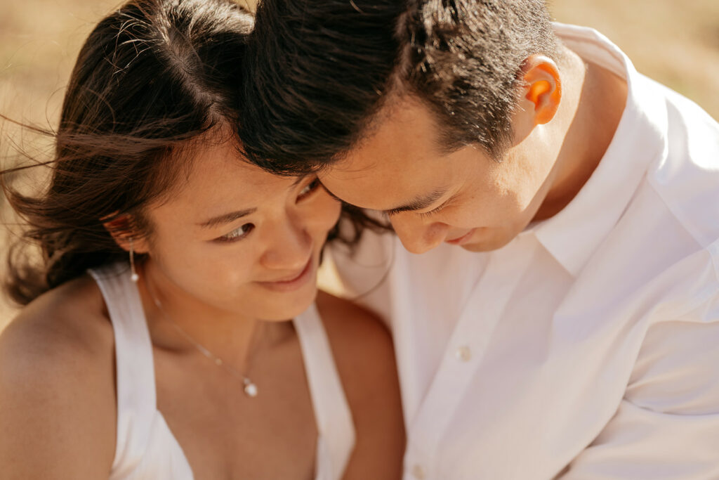 Couple sharing a tender moment outdoors.
