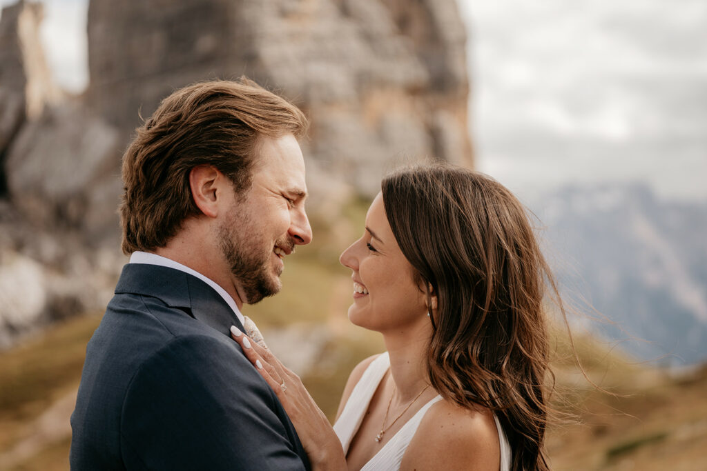 Couple smiling at each other outdoors