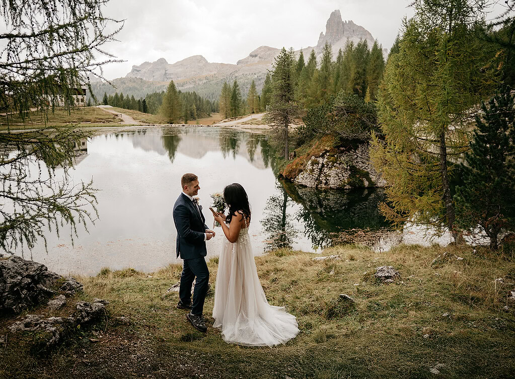 Couple eloping by mountain lake