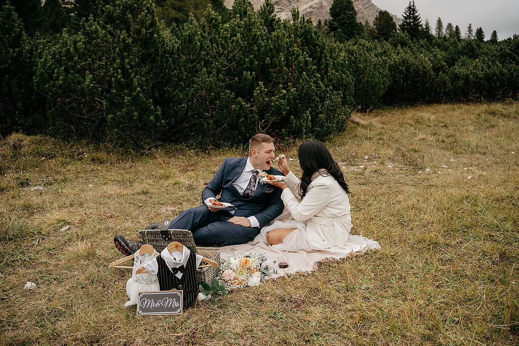 Couple having a picnic in a scenic meadow.